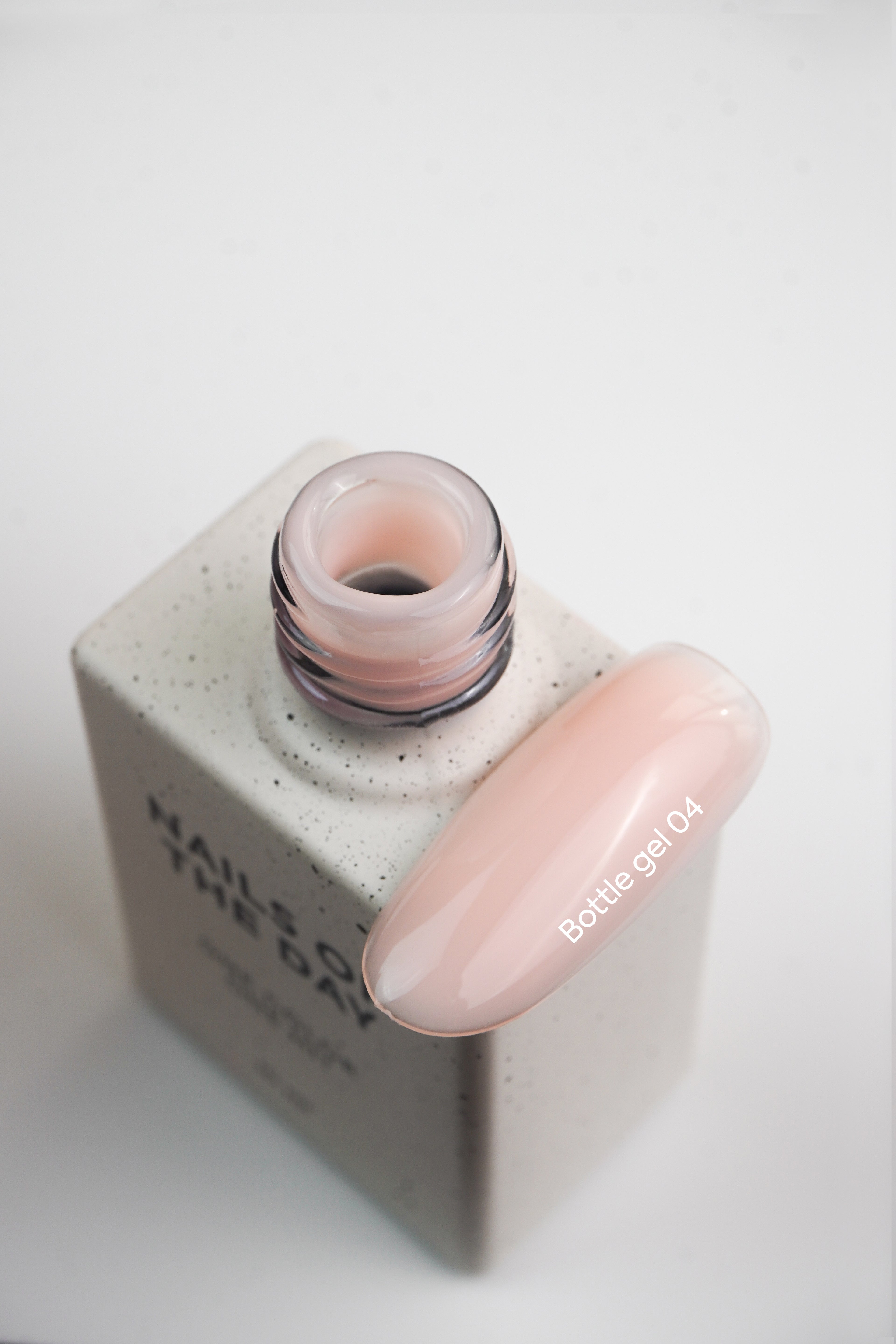 NAILSOFTHEDAY Bottle Gel 04 – milky beige, extra strong gel for nail strengthening.